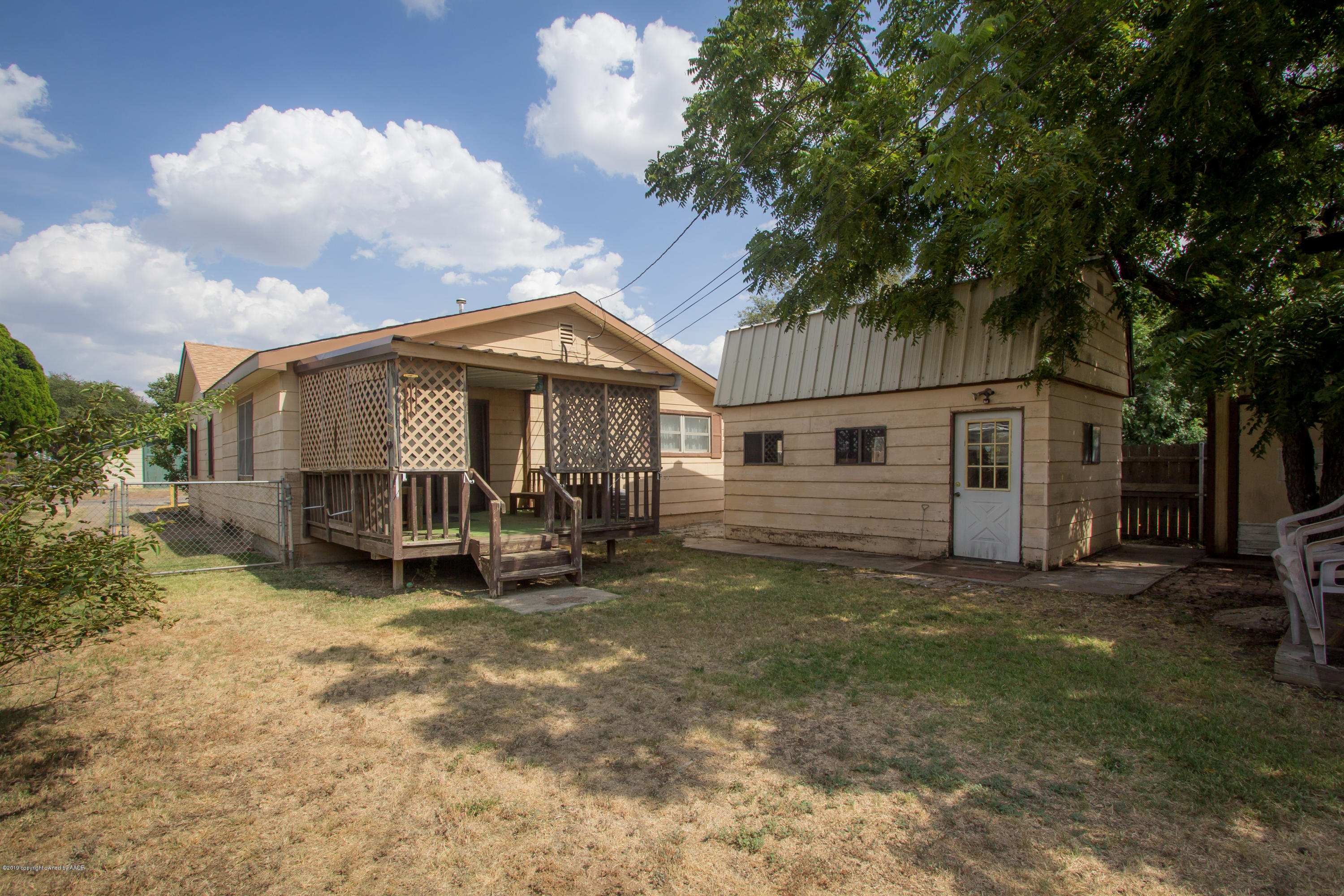 4606 Bowie Street Amarillo, TX 79110 - Photo 38 of 42 a view of a house with a yard and deck