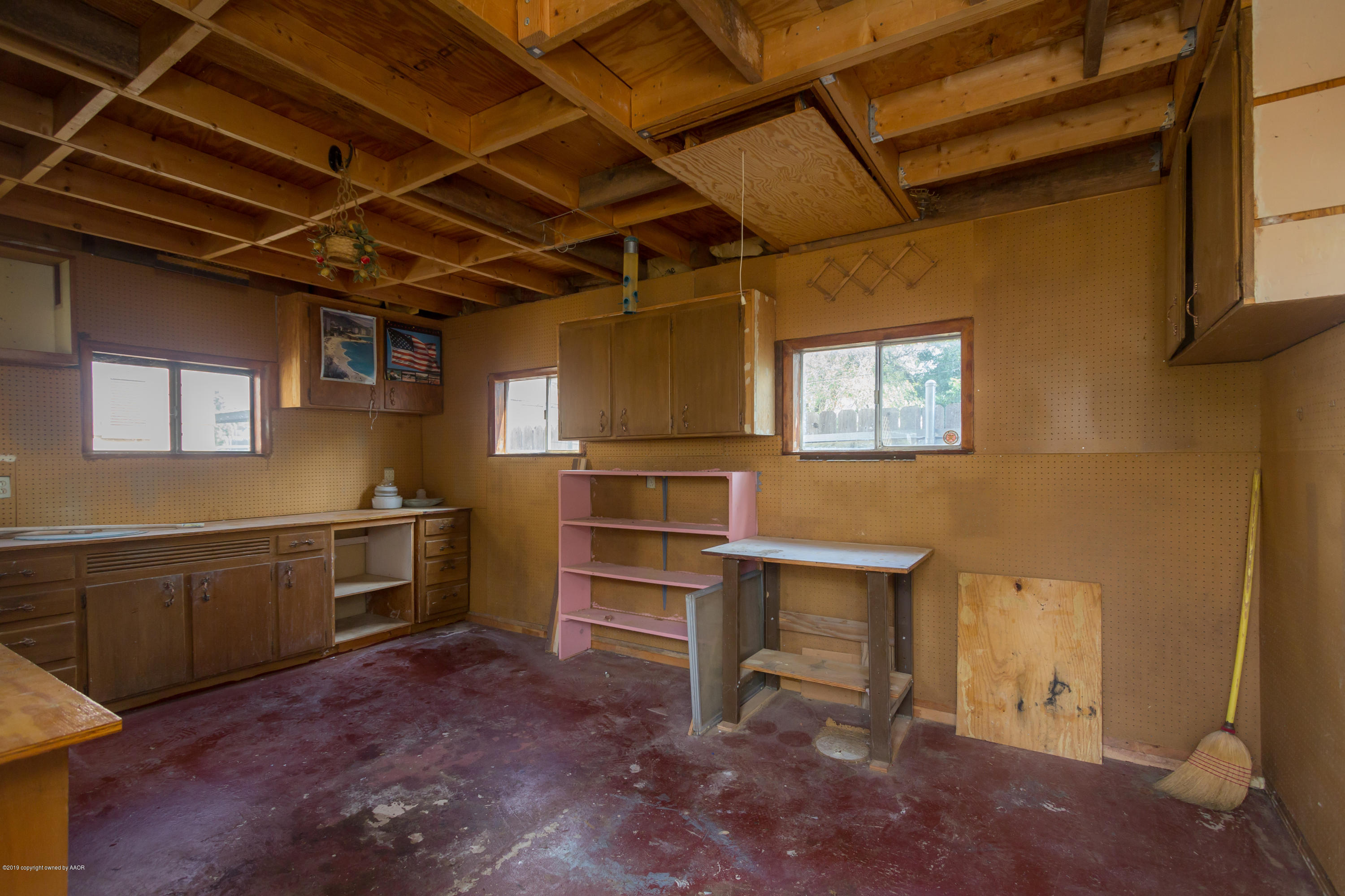 4606 Bowie Street Amarillo, TX 79110 - Photo 40 of 42 a kitchen with cabinets and wooden floor