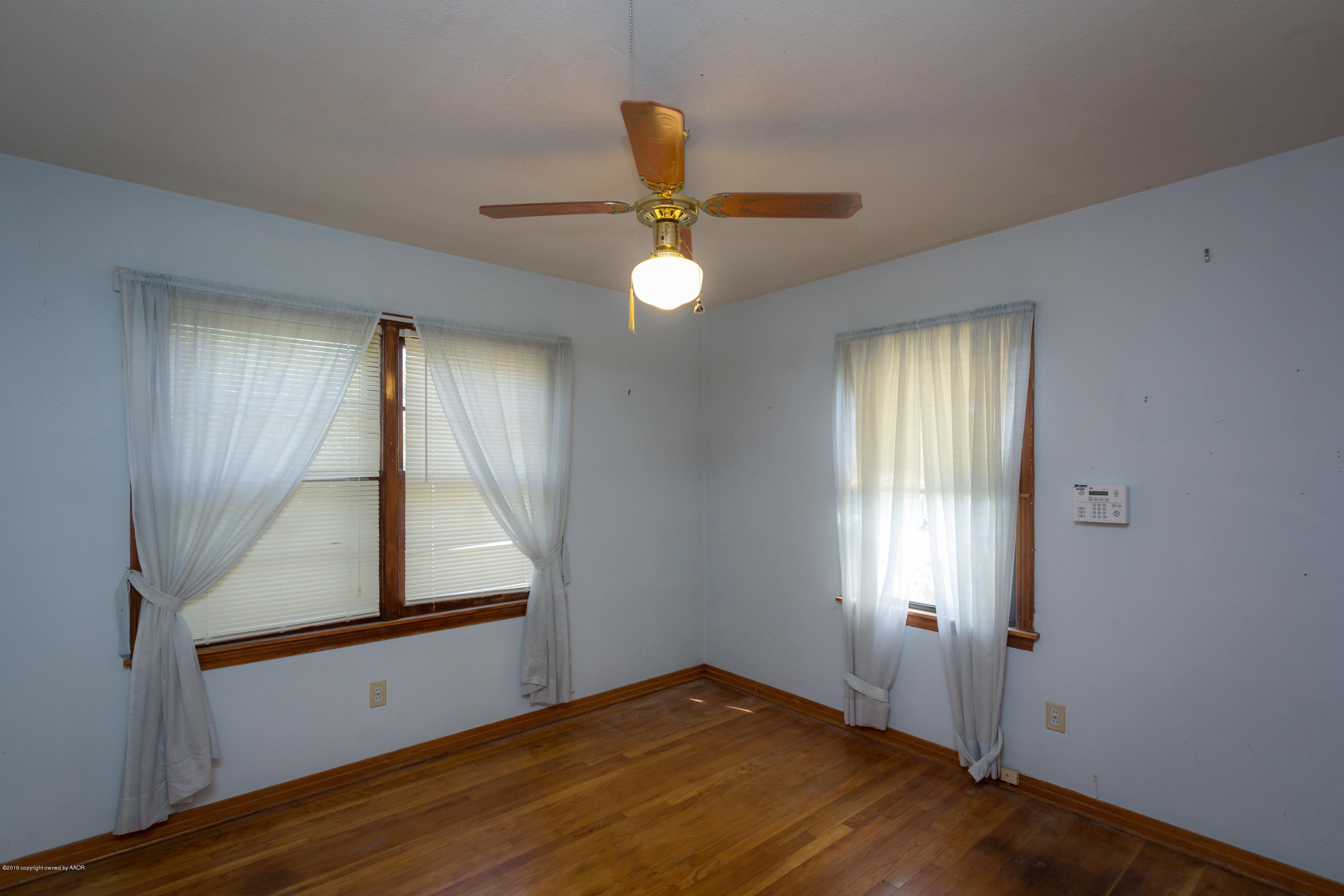 4606 Bowie Street Amarillo, TX 79110 - Photo 5 of 42 a view of an empty room and window