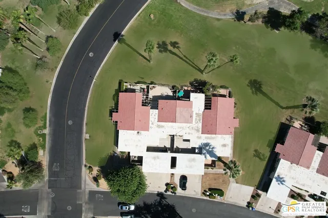 an aerial view of residential house with outdoor space and swimming pool