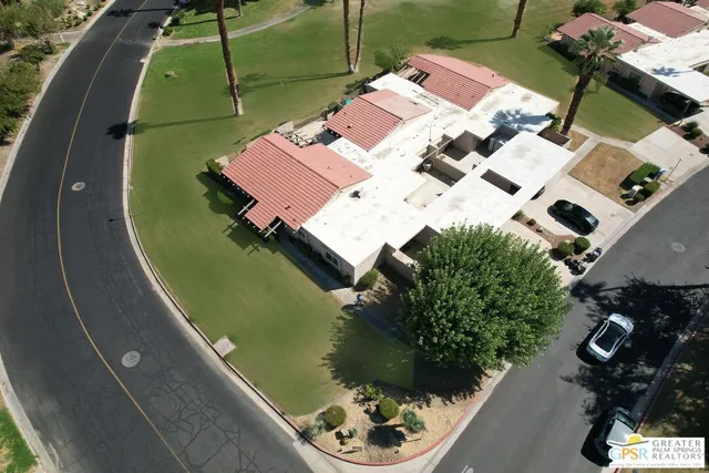 an aerial view of a house with a garden
