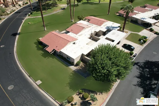 an aerial view of a house with a lake view