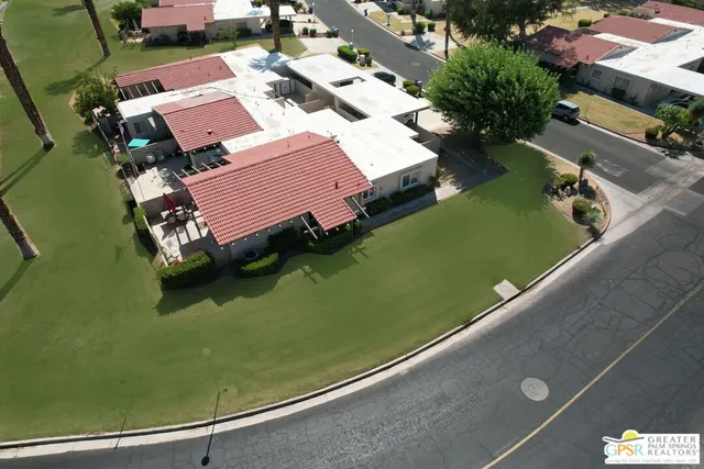 an aerial view of a house with a garden swimming pool and outdoor space