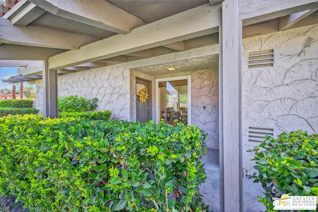 a view of a potted plants in front of a glass door