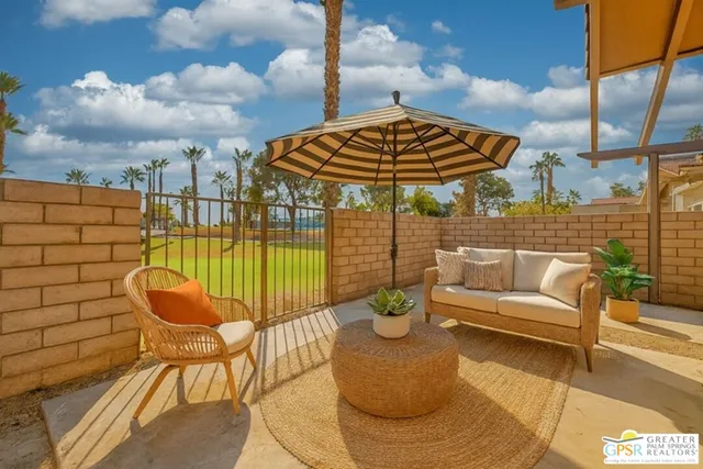 a view of a terrace with furniture