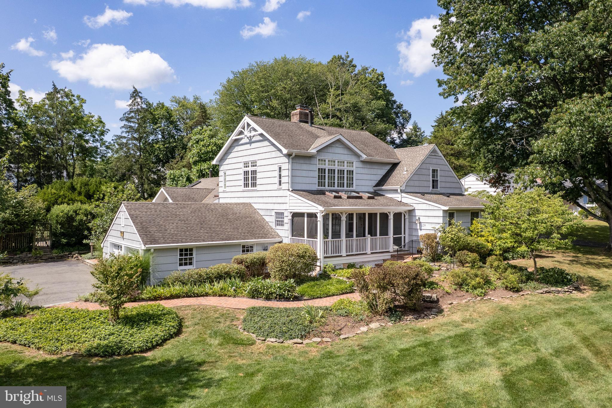 224 King George Road Pennington, NJ 08534 - Photo 1 of 58 a front view of a house with a yard and trees
