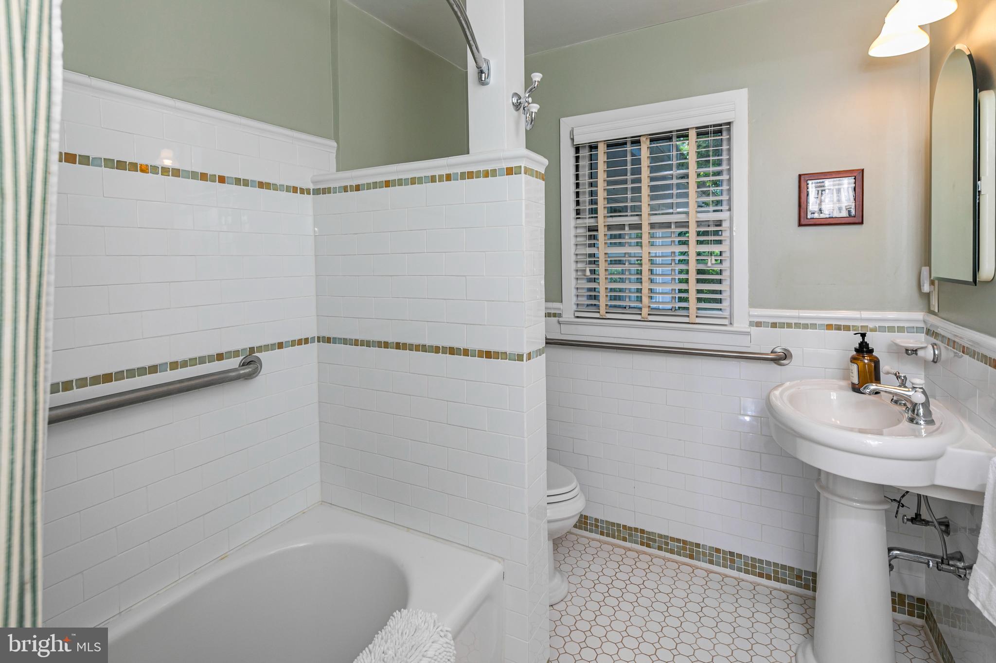 224 King George Road Pennington, NJ 08534 - Photo 23 of 58 a bathroom with a sink a toilet and shower