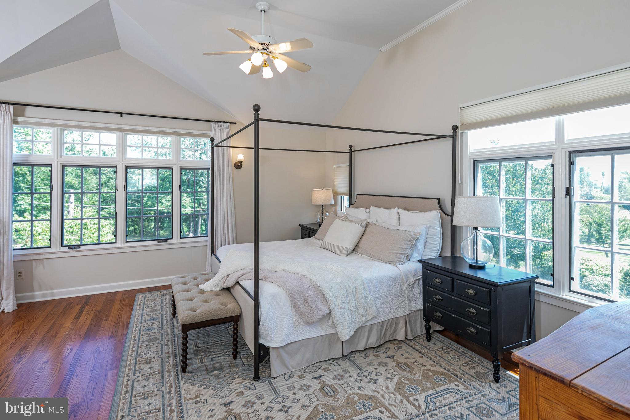 224 King George Road Pennington, NJ 08534 - Photo 32 of 58 a bedroom with a bed lamps and window