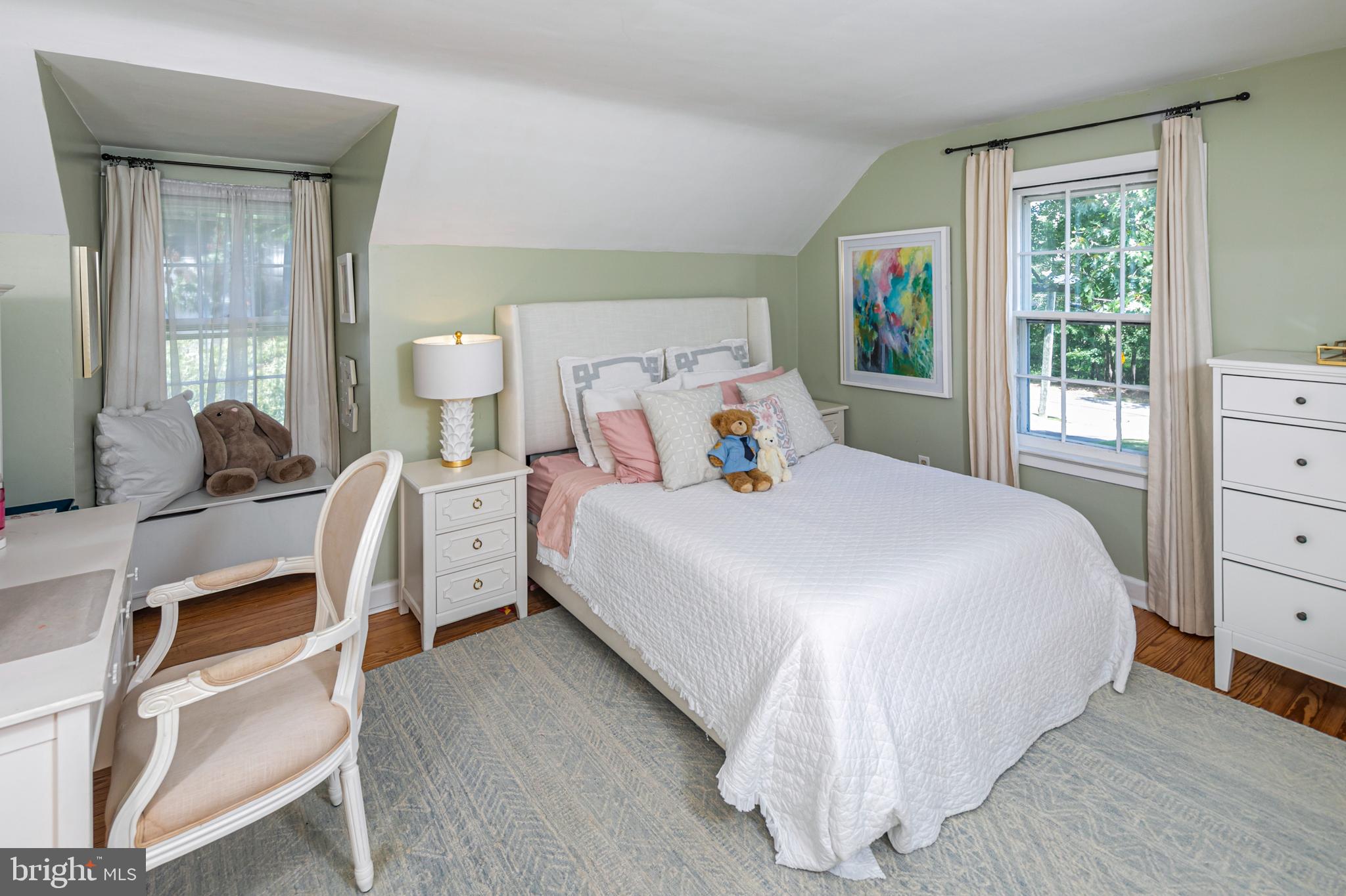 224 King George Road Pennington, NJ 08534 - Photo 37 of 58 a bedroom with a bed and large windows