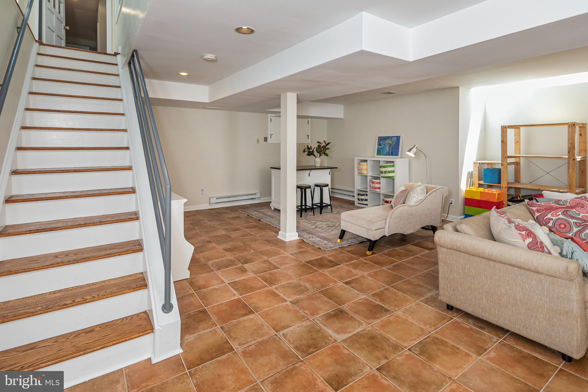 224 King George Road Pennington, NJ 08534 - Photo 39 of 58 a living room with furniture and stairs
