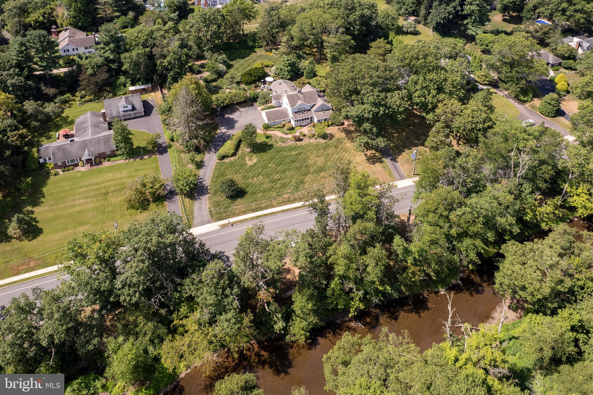 224 King George Road Pennington, NJ 08534 - Photo 55 of 58 an aerial view of residential house with yard and lake view