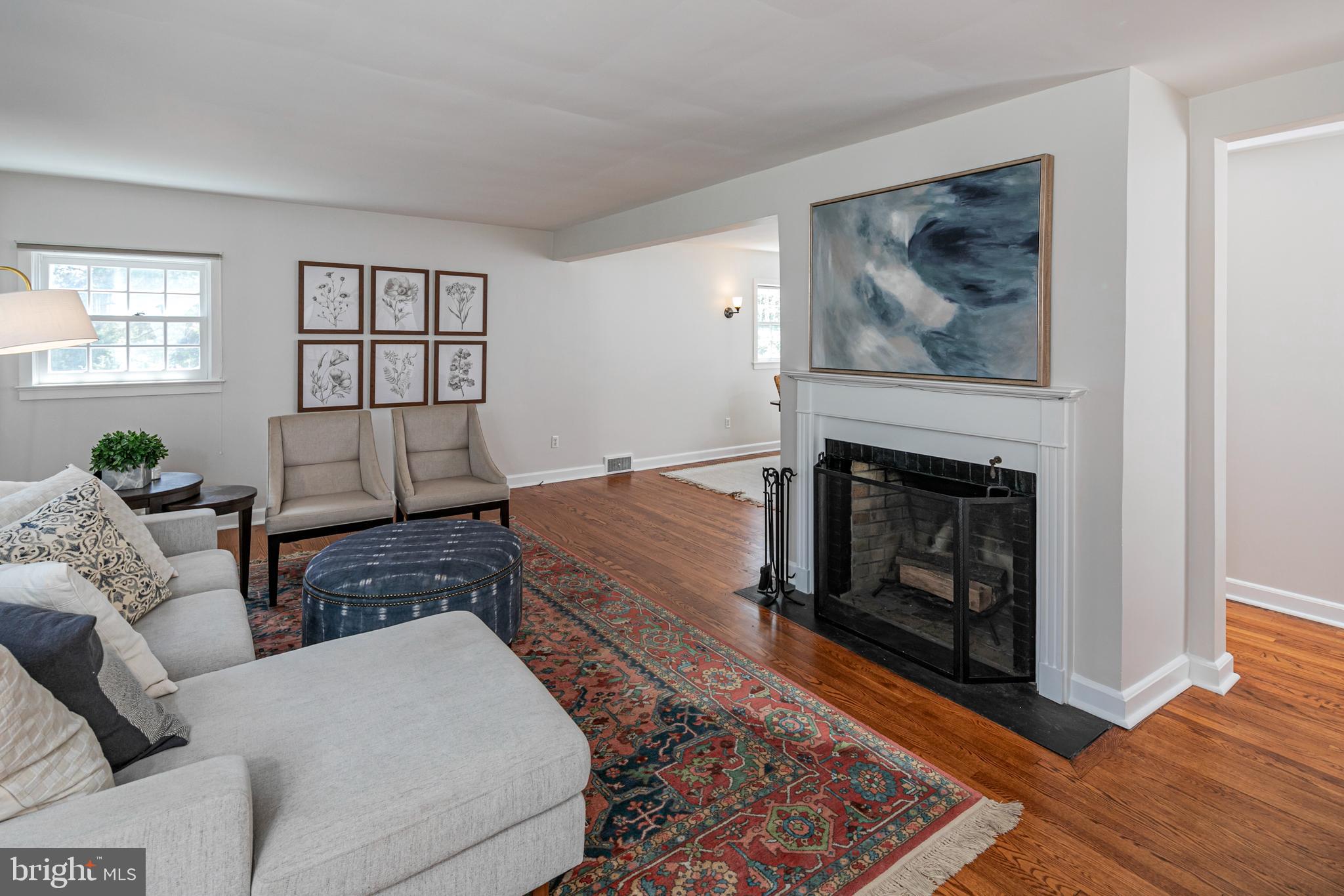 224 King George Road Pennington, NJ 08534 - Photo 10 of 58 a living room with furniture and a fireplace