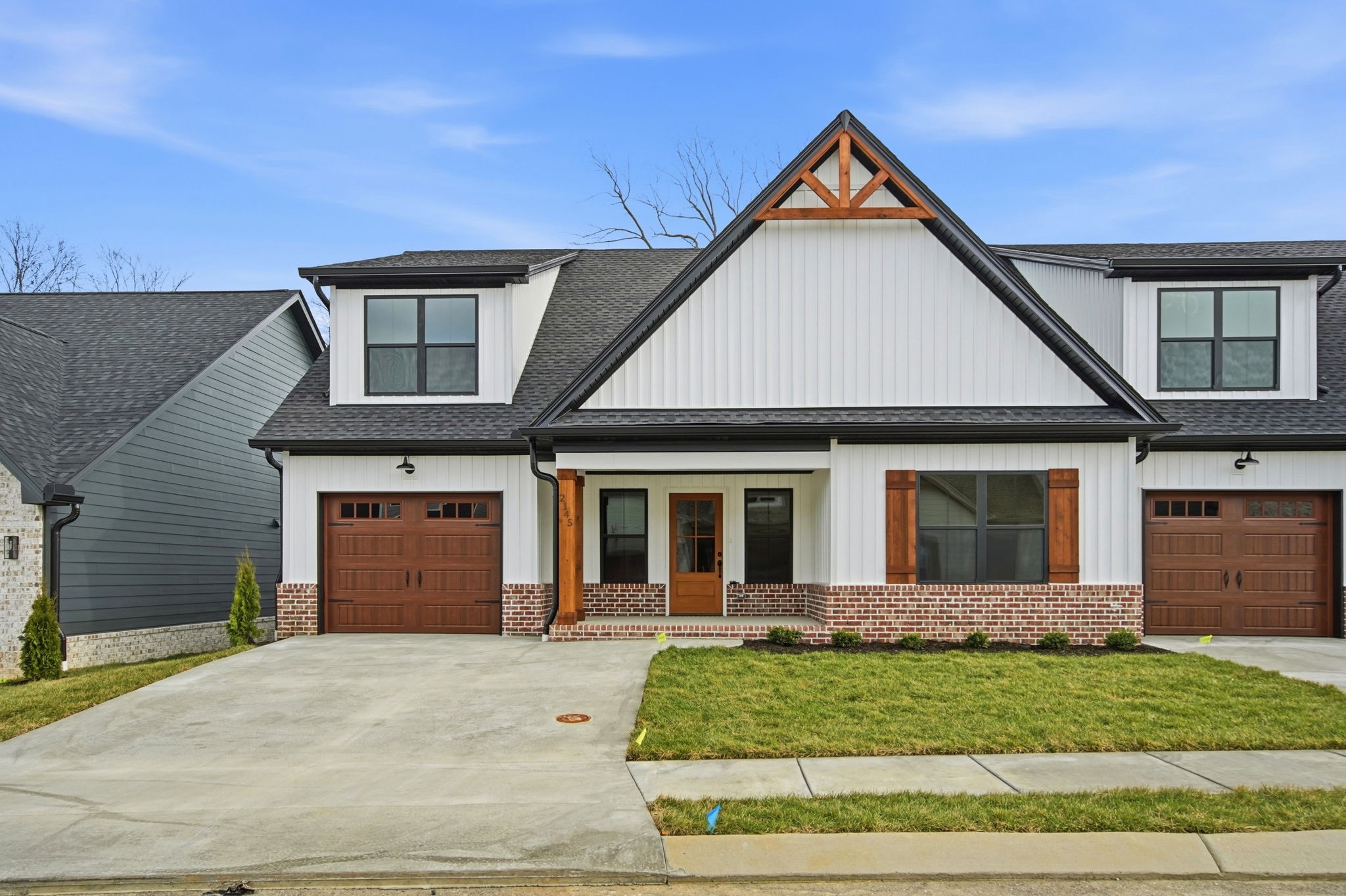 2145 Rylee Way, Unit 5 Greenbrier, TN 37073 - Photo 2 of 32 a front view of a house with a yard and garage