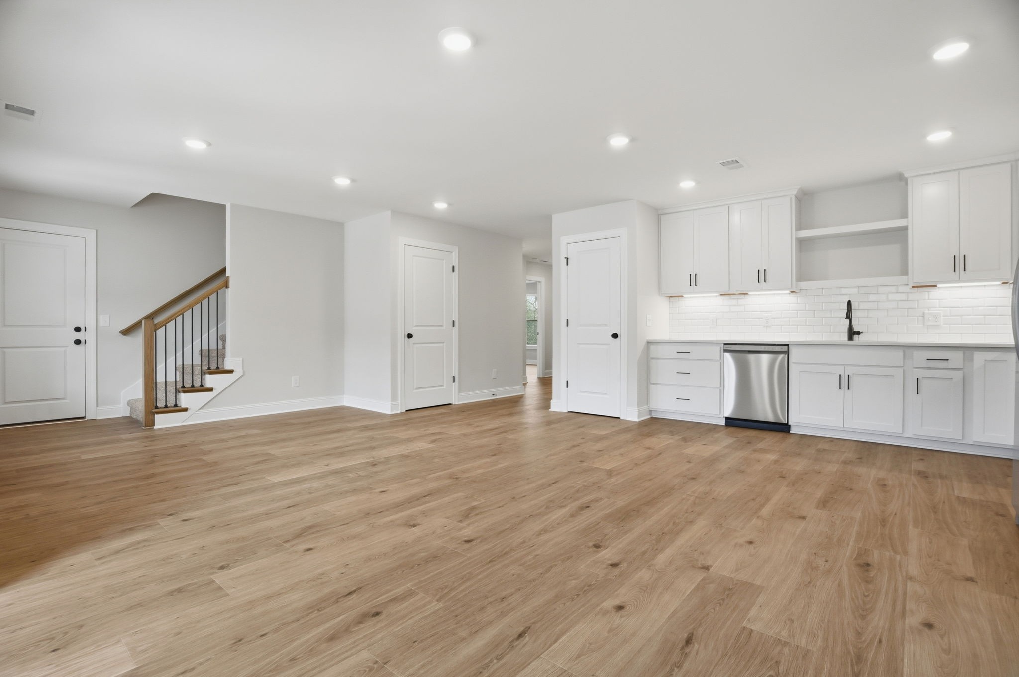 2145 Rylee Way, Unit 5 Greenbrier, TN 37073 - Photo 10 of 32 a view of kitchen with wooden floor and window