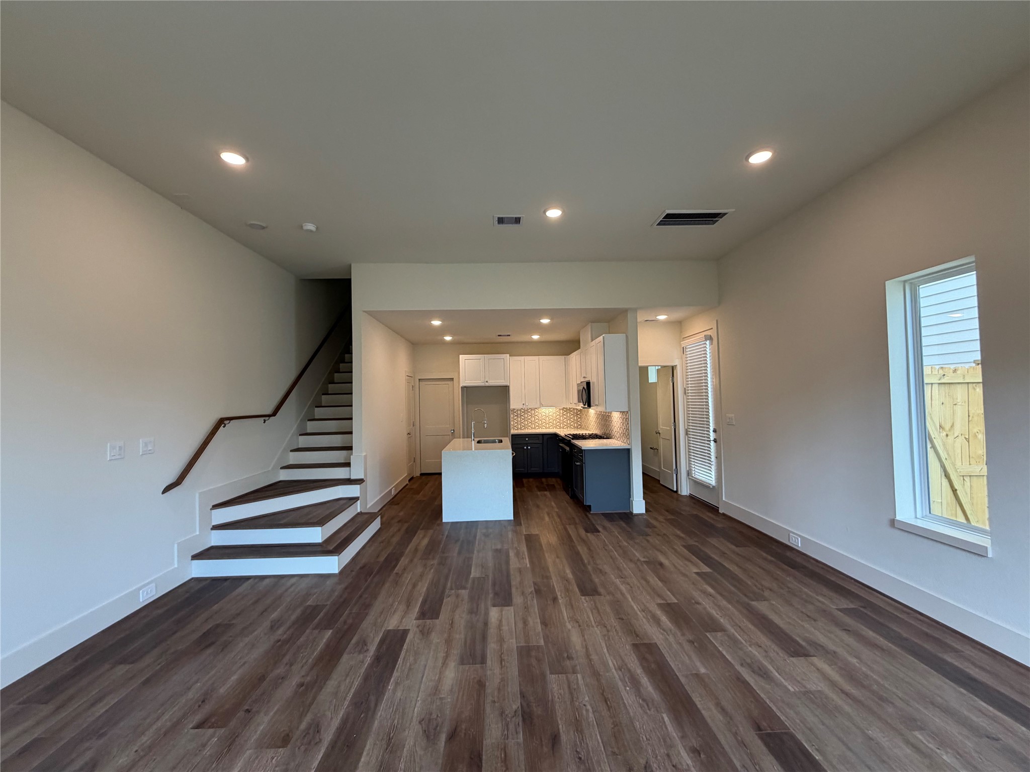 879 Rachel Street, Unit E Houston, TX 77091 - Photo 11 of 34 a view of entryway and hall with wooden floor