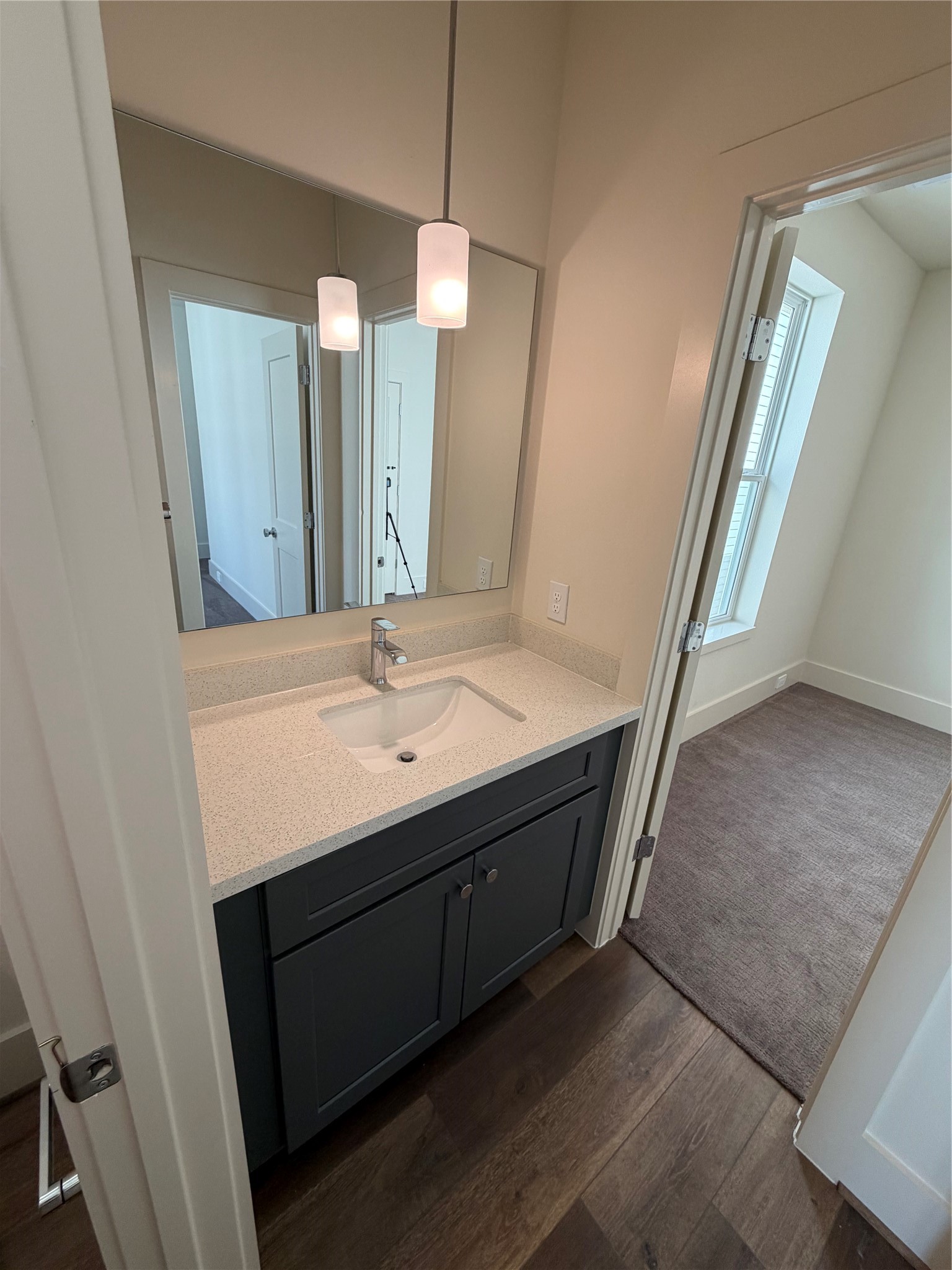 879 Rachel Street, Unit E Houston, TX 77091 - Photo 17 of 34 a bathroom with a sink a vanity and a mirror
