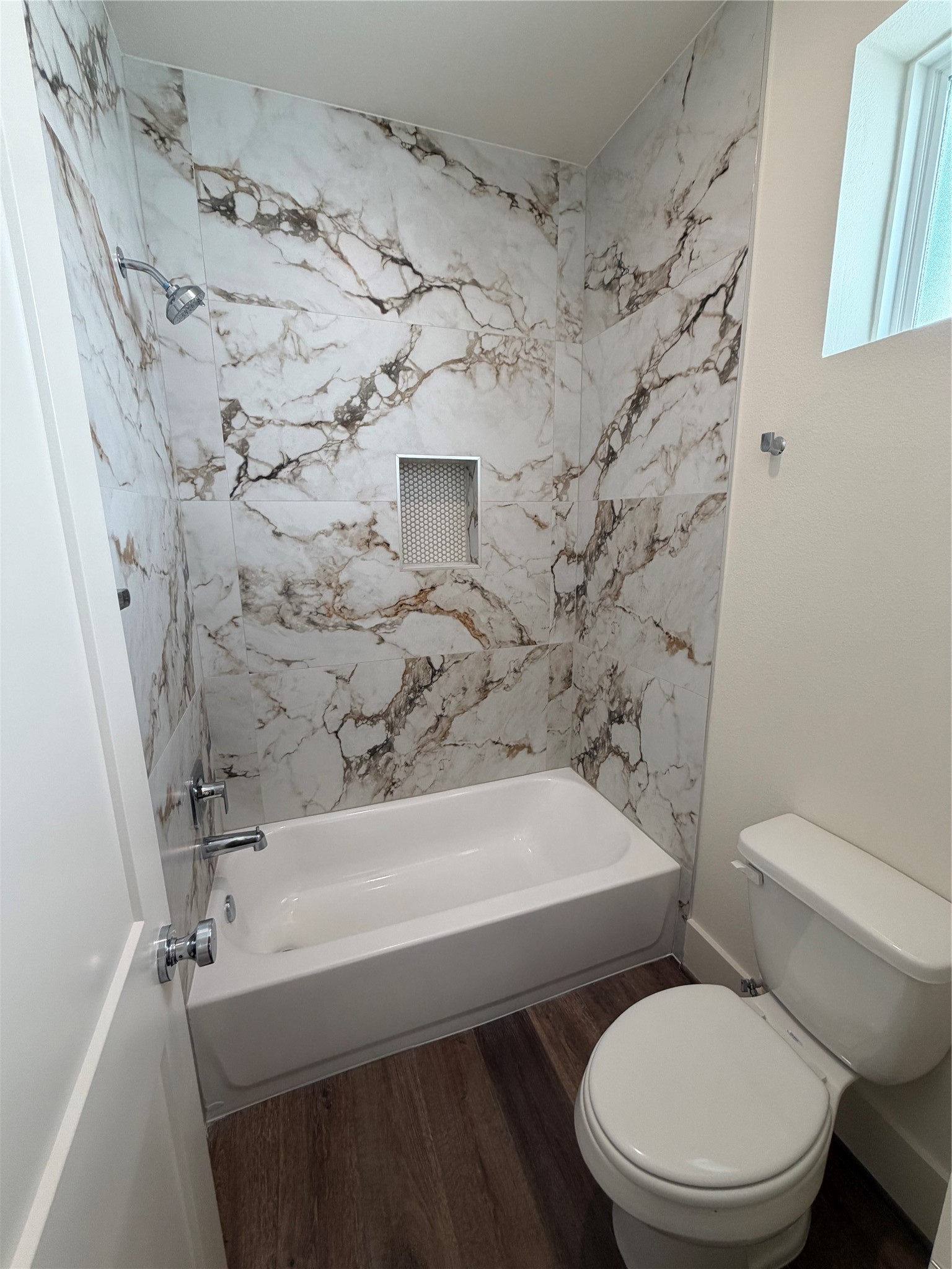 879 Rachel Street, Unit E Houston, TX 77091 - Photo 18 of 34 a bathroom with a toilet and a shower