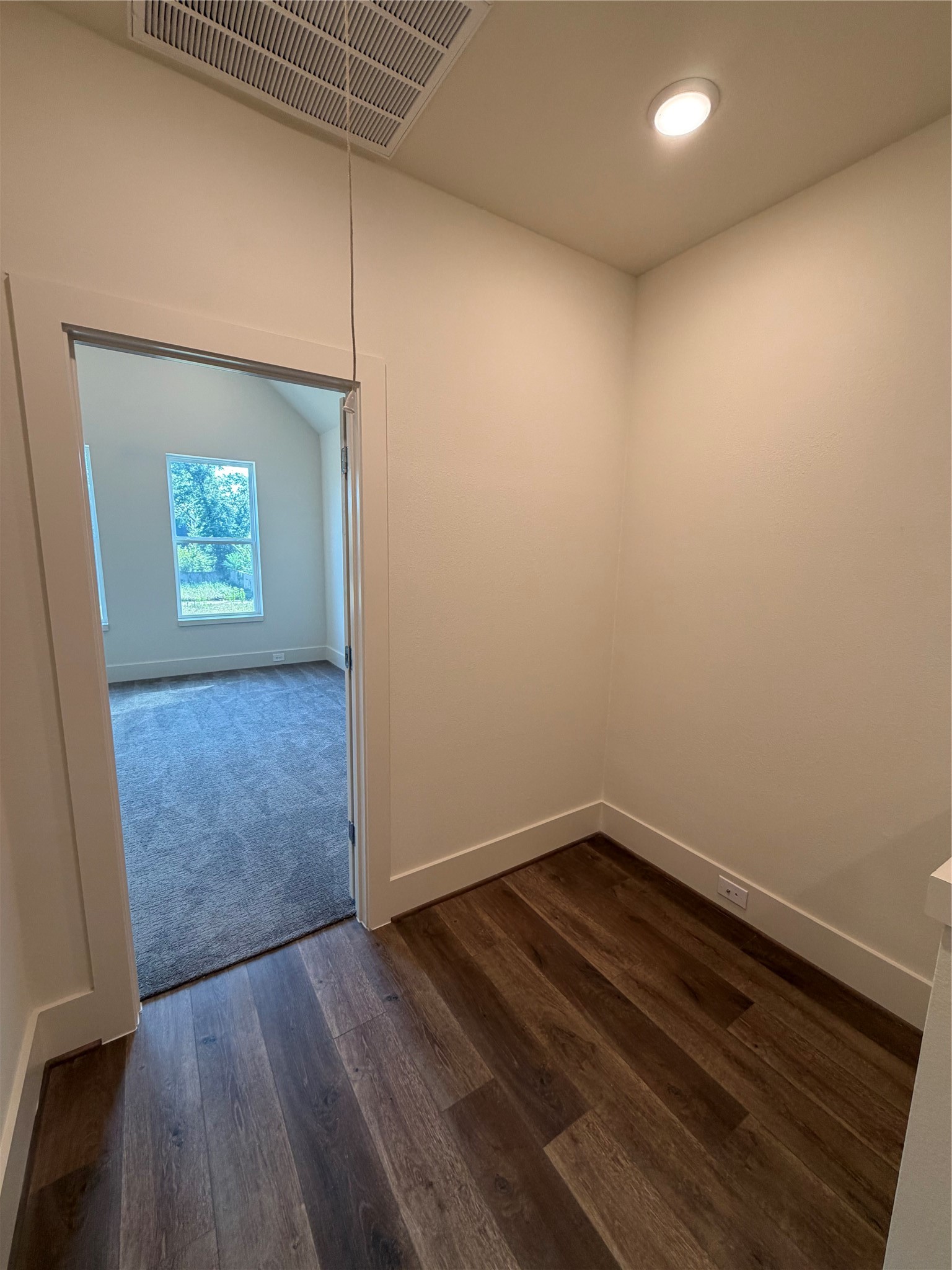 879 Rachel Street, Unit E Houston, TX 77091 - Photo 30 of 34 an empty room with wooden floor and windows