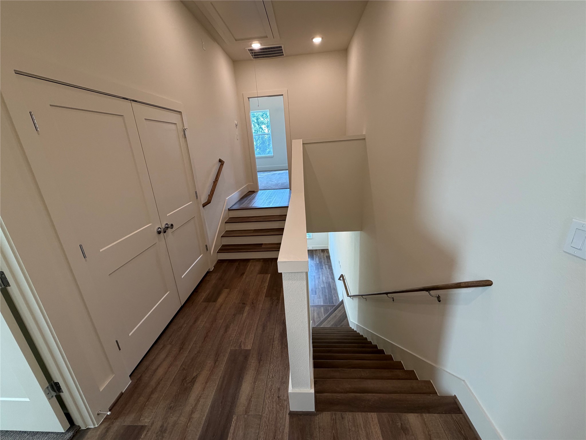 879 Rachel Street, Unit E Houston, TX 77091 - Photo 32 of 34 a view of entryway and hall with wooden floor