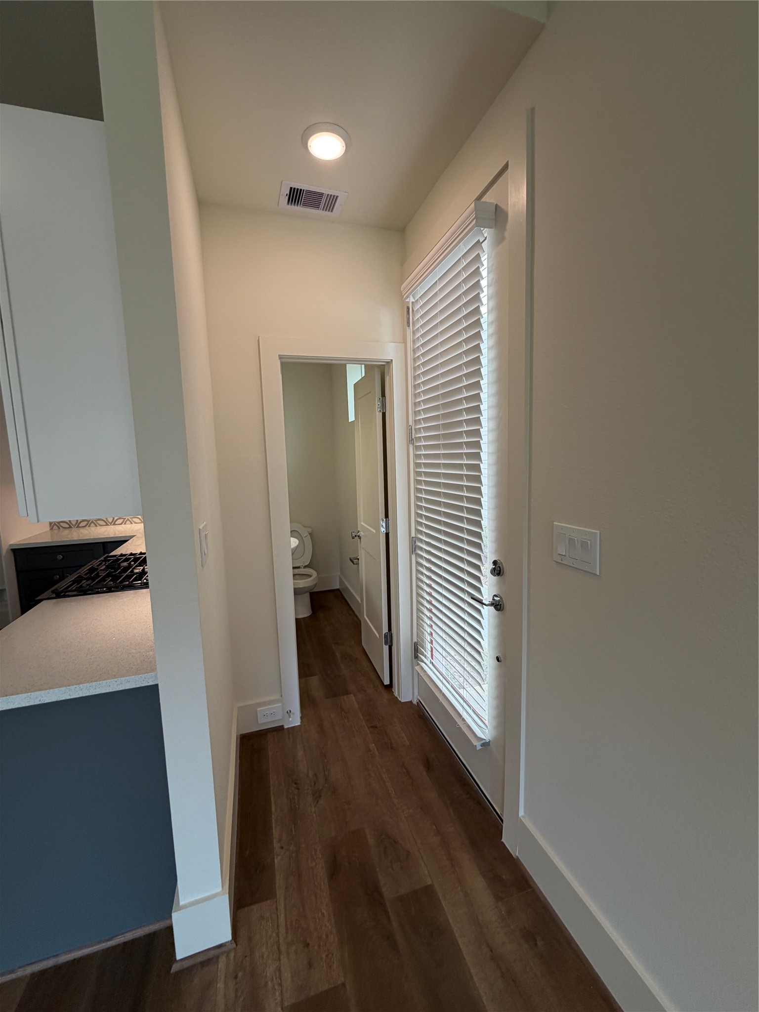 879 Rachel Street, Unit E Houston, TX 77091 - Photo 6 of 34 a view of a hallway with wooden floor