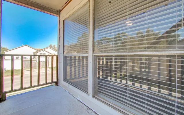 a view of a backyard with wooden fence