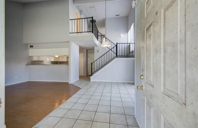 a view of a hallway view with staircase