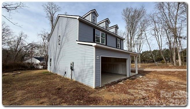 9472 Caddell Road Fort Mill, SC 29707 - Photo 12 of 17 a view of a house with a yard