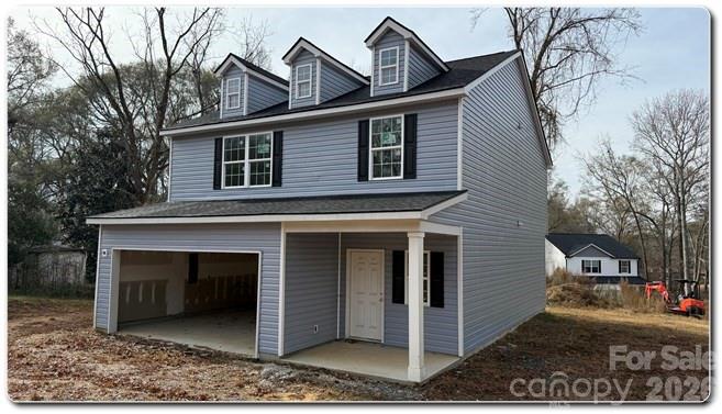 9472 Caddell Road Fort Mill, SC 29707 - Photo 15 of 17 a front view of a house with garden