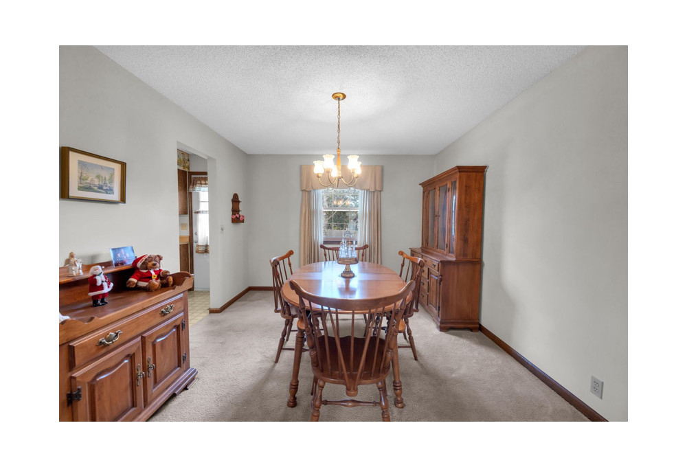 960 Bunker Lane Decatur, IL 62526 - Photo 8 of 24 a view of a dining room with furniture and window