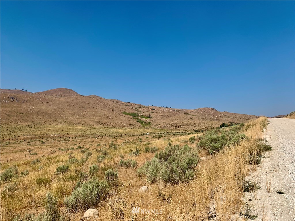 0 Bill Shaw Road Pateros, WA 98846 - Photo 3 of 19 a view of a mountain range in a cloudy sky