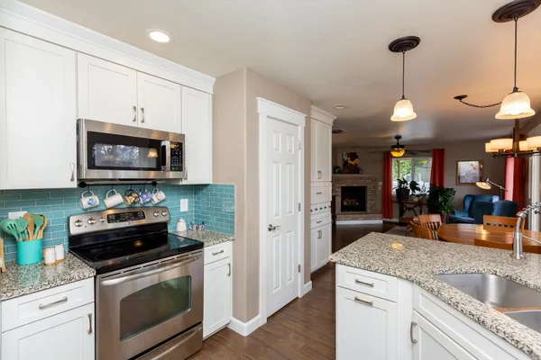 a kitchen with a stove and a microwave
