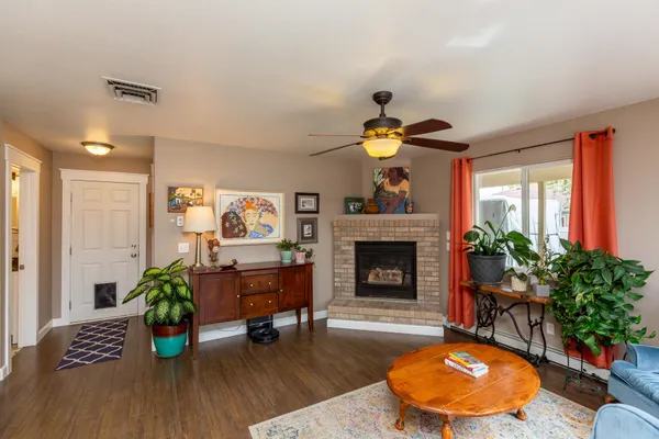 a living room with furniture and a fireplace