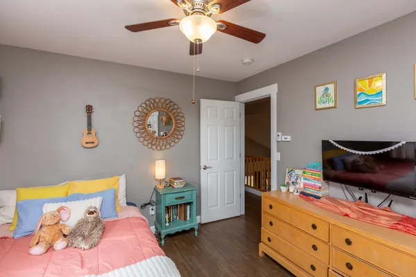 a bedroom with a bed and a chandelier