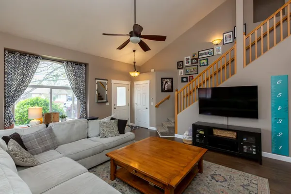a living room with furniture and a flat screen tv