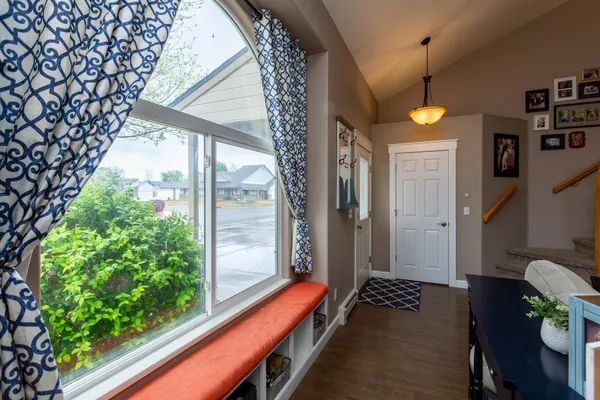 a view of spacious bedroom with furniture and garden view