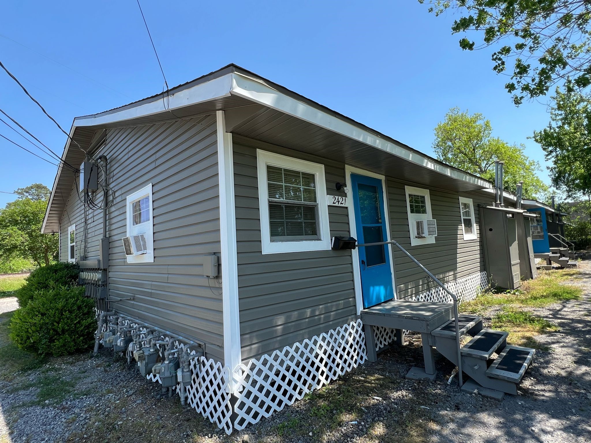 2405 Franklin Street Beaumont, TX 77701 - Photo 2 of 15 a backyard of a house with yard and outdoor seating
