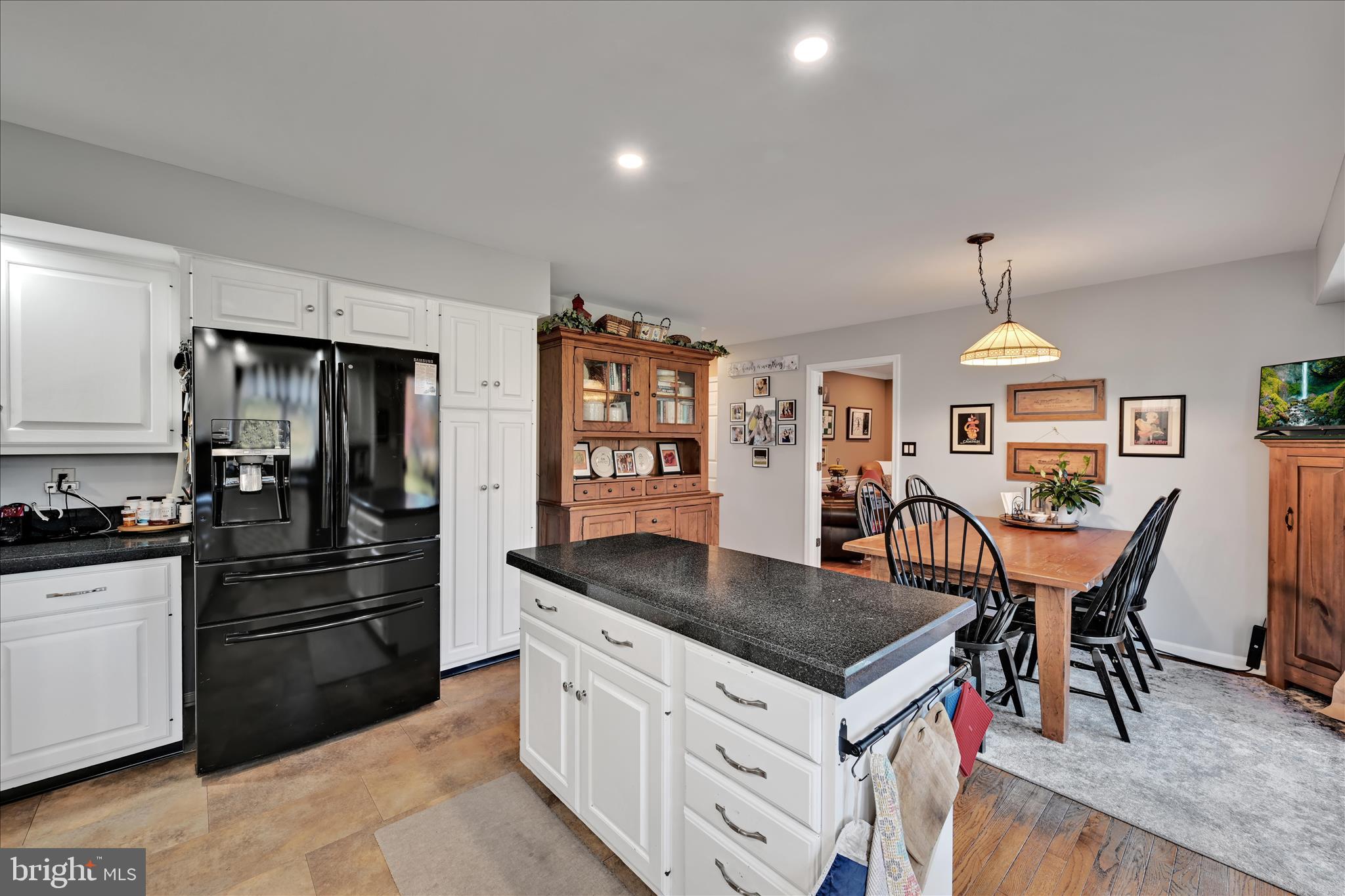 206 Marie Road West Chester, PA 19380 - Photo 19 of 51 a kitchen with a stove a refrigerator and a dining table