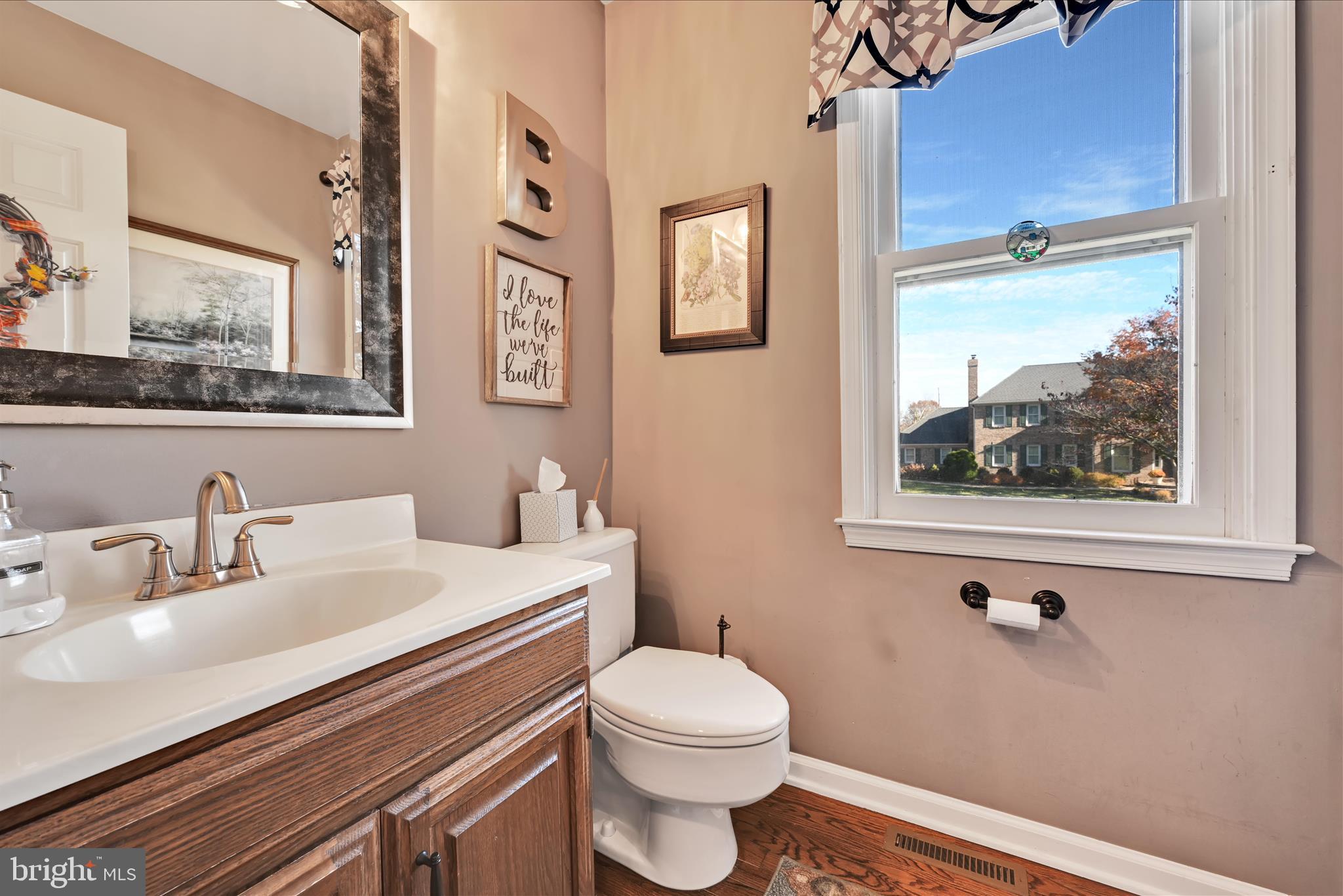 206 Marie Road West Chester, PA 19380 - Photo 20 of 51 a bathroom with a toilet a sink and mirror