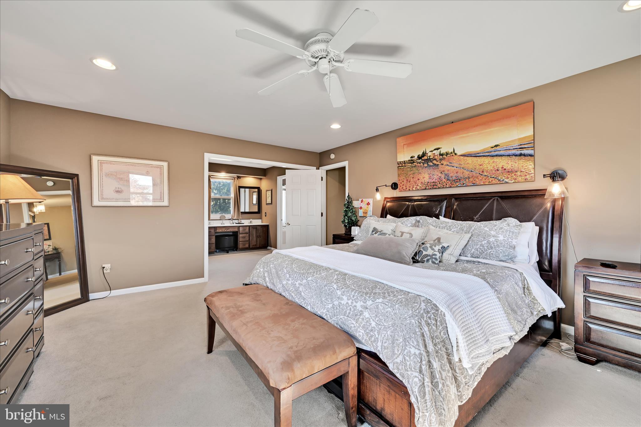 206 Marie Road West Chester, PA 19380 - Photo 22 of 51 a spacious bedroom with a bed a dresser and potted plant