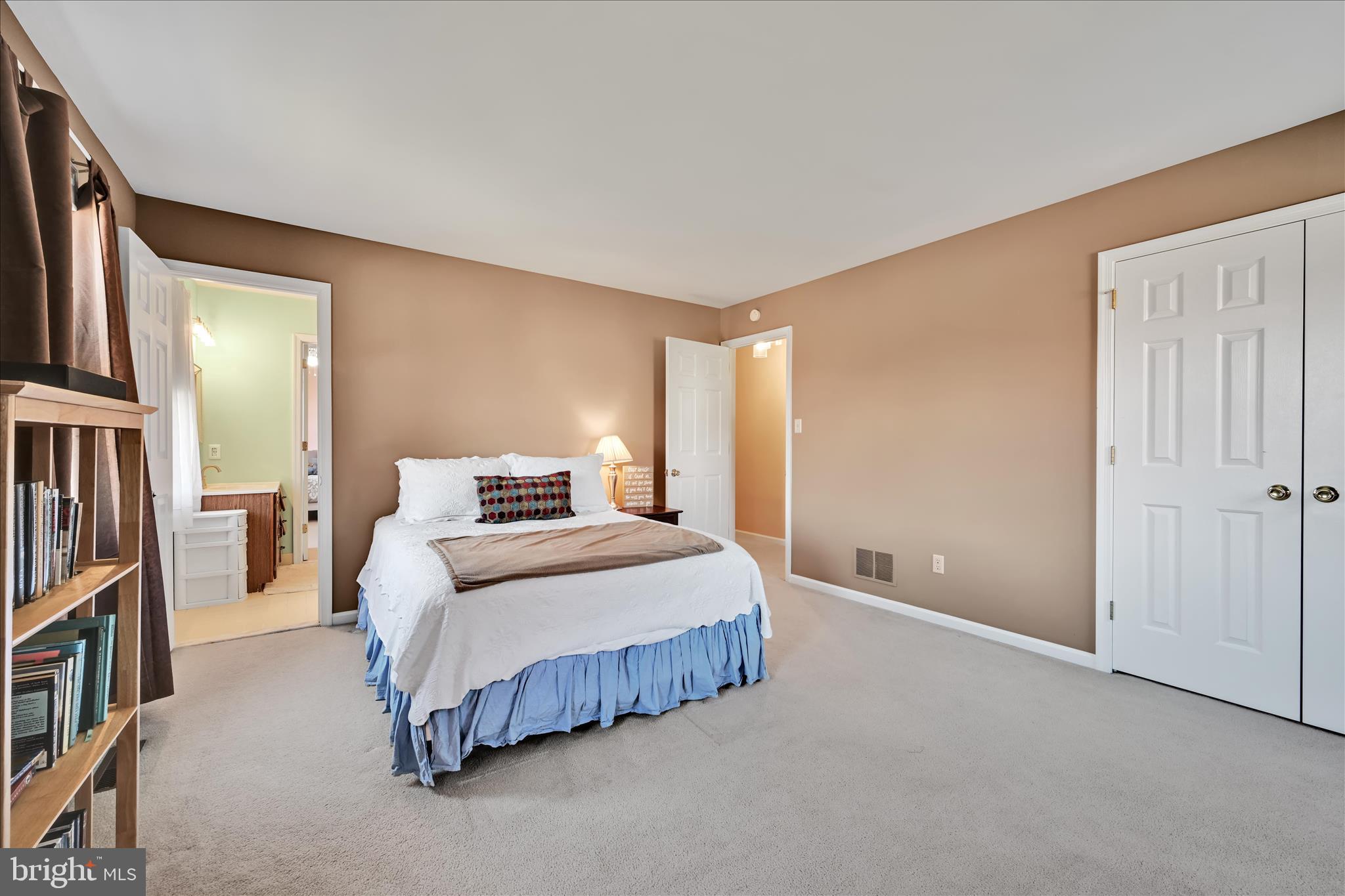 206 Marie Road West Chester, PA 19380 - Photo 33 of 51 a bedroom with a bed lamp and a large window