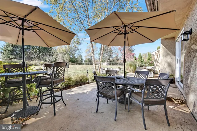 a view of an outdoor space with furniture and umbrella