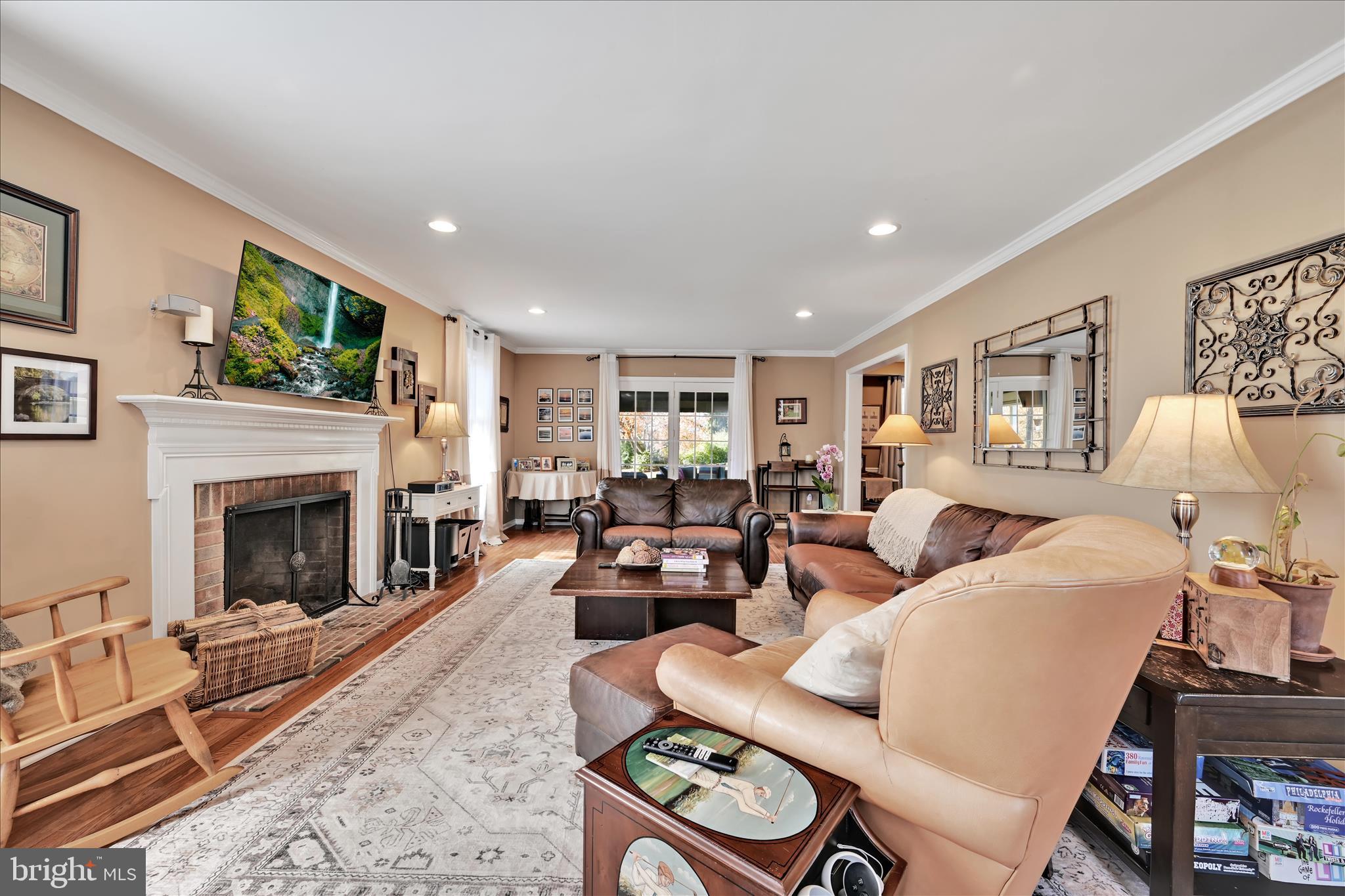 206 Marie Road West Chester, PA 19380 - Photo 8 of 51 a living room with furniture a fireplace and a flat screen tv