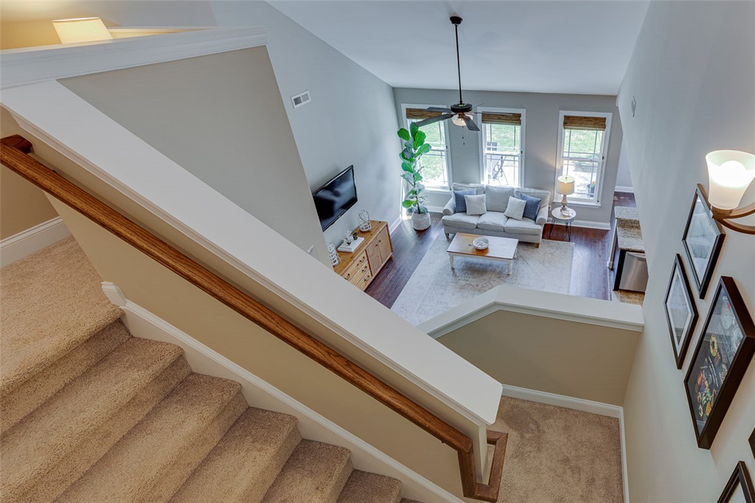 203 Streams Way Anderson, SC 29625 - Photo 28 of 47 This inviting living space features high ceilings and a view from the upper landing.