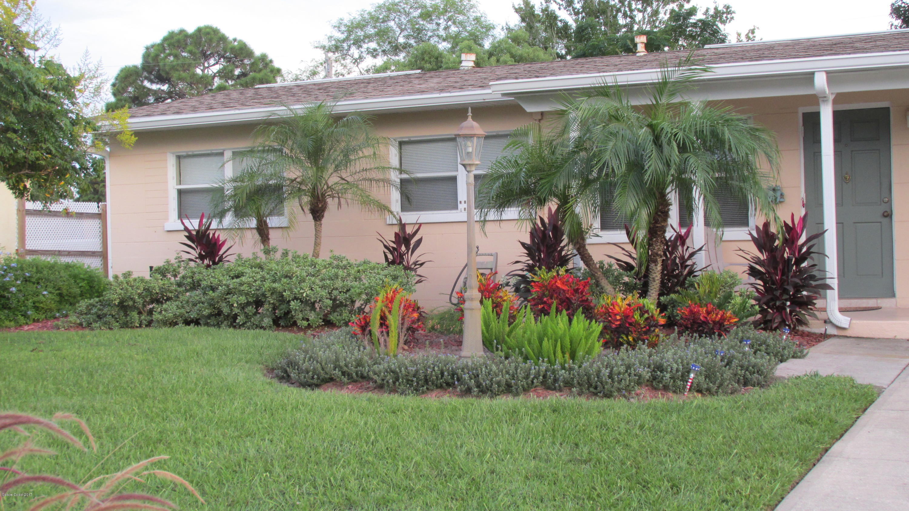 2235 Allan Adale Road Melbourne, FL 32935 - Photo 3 of 26 close front..foliage