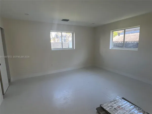 an empty room with windows