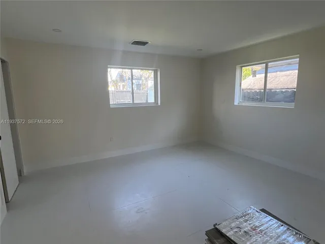 an empty room with windows