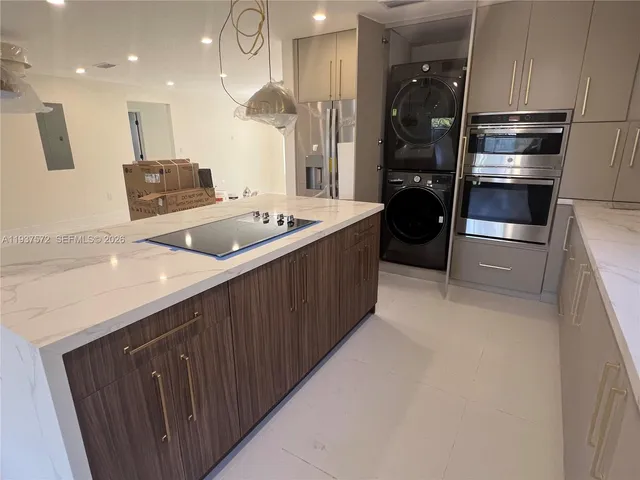 a kitchen with a sink and refrigerator