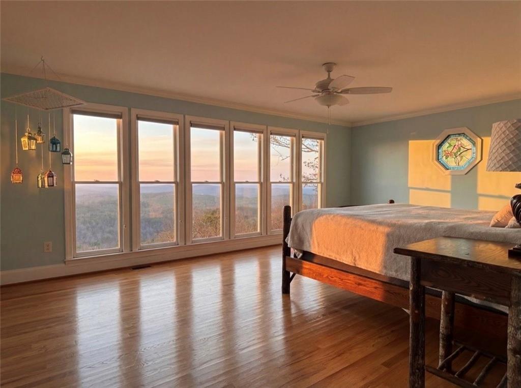 1015 Eagle Ridge Road Dawsonville, GA 30534 - Photo 14 of 64 a living room with a large window and wooden floor