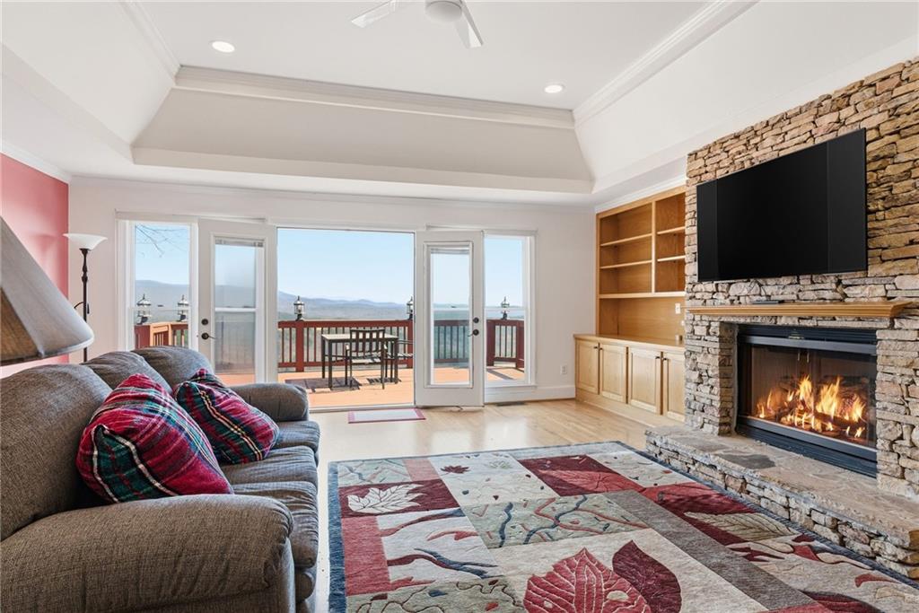 1015 Eagle Ridge Road Dawsonville, GA 30534 - Photo 17 of 64 a living room with furniture and a fireplace