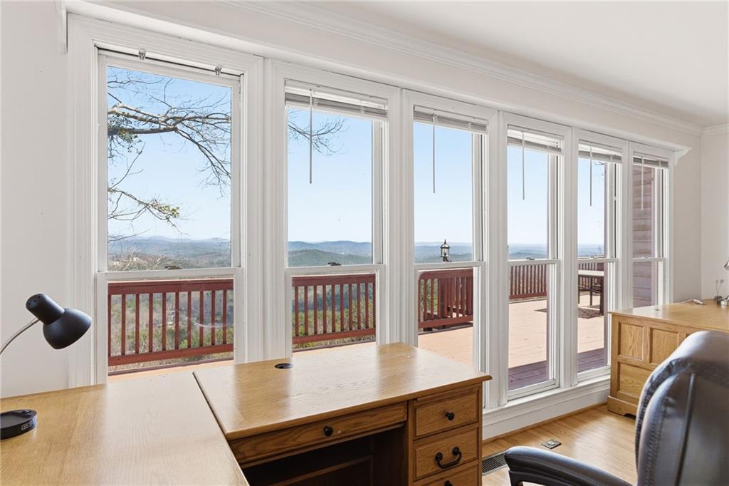 1015 Eagle Ridge Road Dawsonville, GA 30534 - Photo 21 of 64 a room with furniture and a window